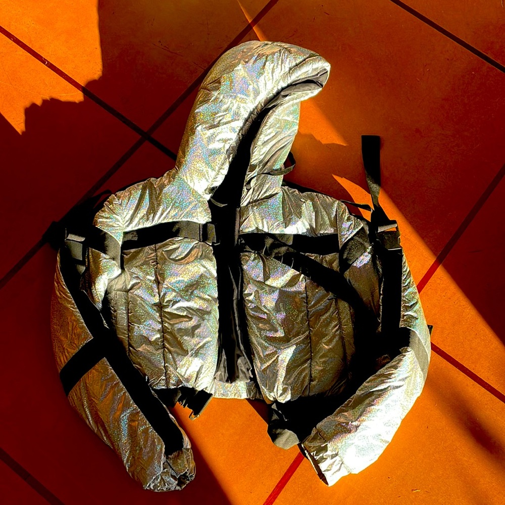 Dolls Kill disco festival glitter silver puffy jacket